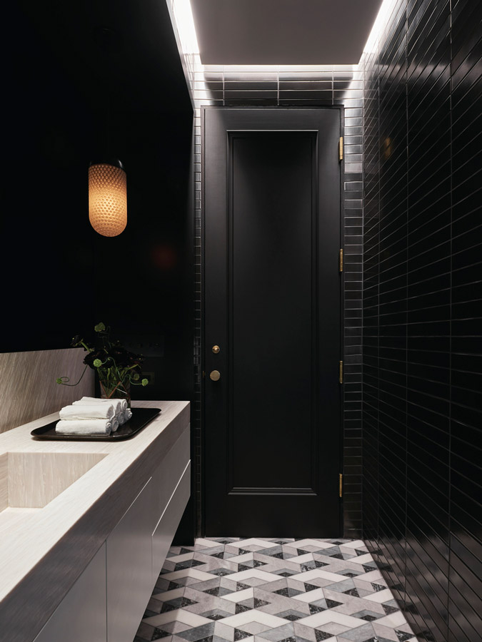 dark modern nyc residential bathroom build out