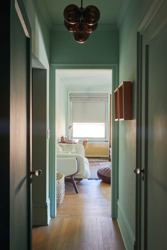 green hallway and bedroom in upper east side apartment renovation